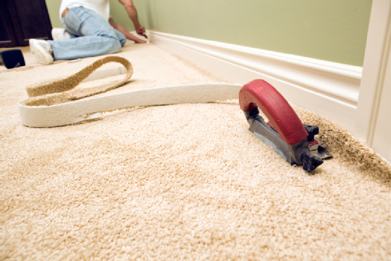 Bedroom Carpet Installation with Cutter and Worker